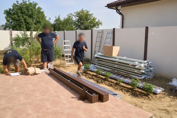 Pergola materials unloaded on the terrace of the house