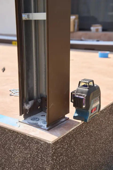 Aligning the pergola post with a laser level