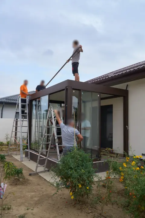 Adjusting the glass enclosure as evening falls