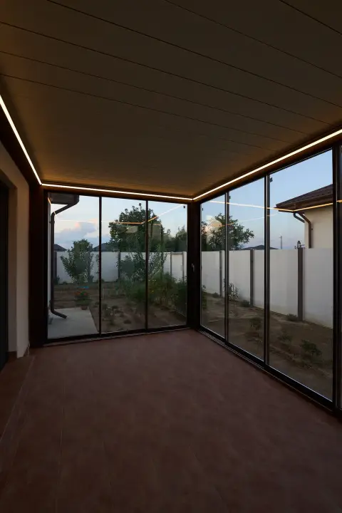 Interior of the enclosed terrace with perimeter LED lighting