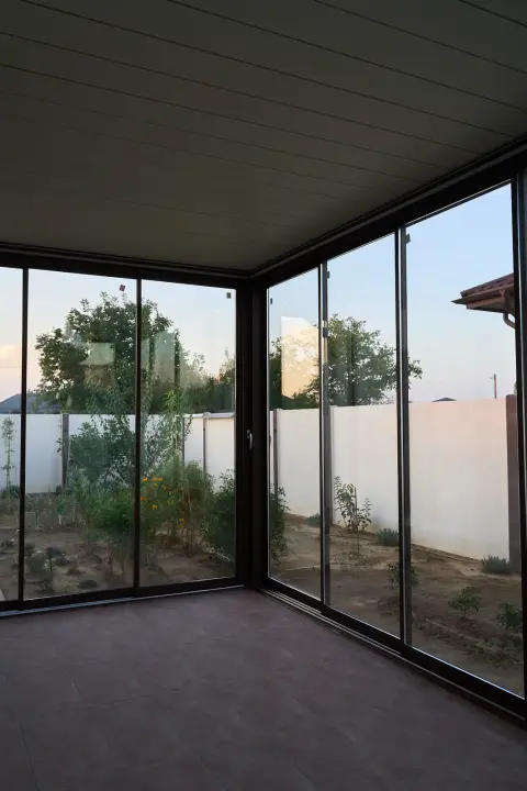 Interior of the terrace in daylight with the louvres closed
