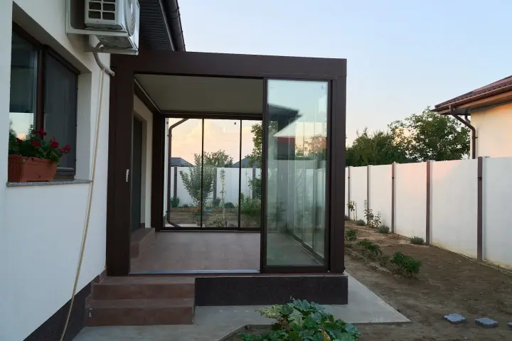 Glass terrace enclosure seen from the garden