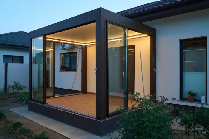 Sliding glass panels opened towards the garden