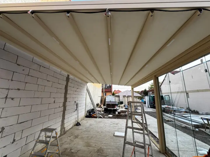 The PVC membrane of the Wave pergola extended, seen from below