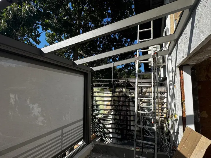 Fitting the zip screens on the upper-floor terrace